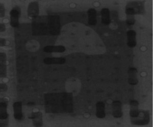 Figure 2. An X-Ray image of the voiding between the QFN thermal pad and the PWB period
