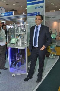 Sameer Gandhi, MD, OMRON Automation showcasing the bottling machine solution at OMRON booth  At PackPlus 2014