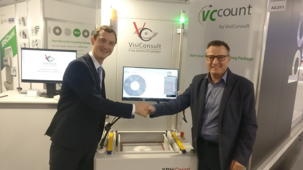 Nico Federsel and Harry Sauter sealed the deal with a handshake during productronica 2019.